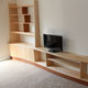 Curving bookcase in sycamore and sapele
